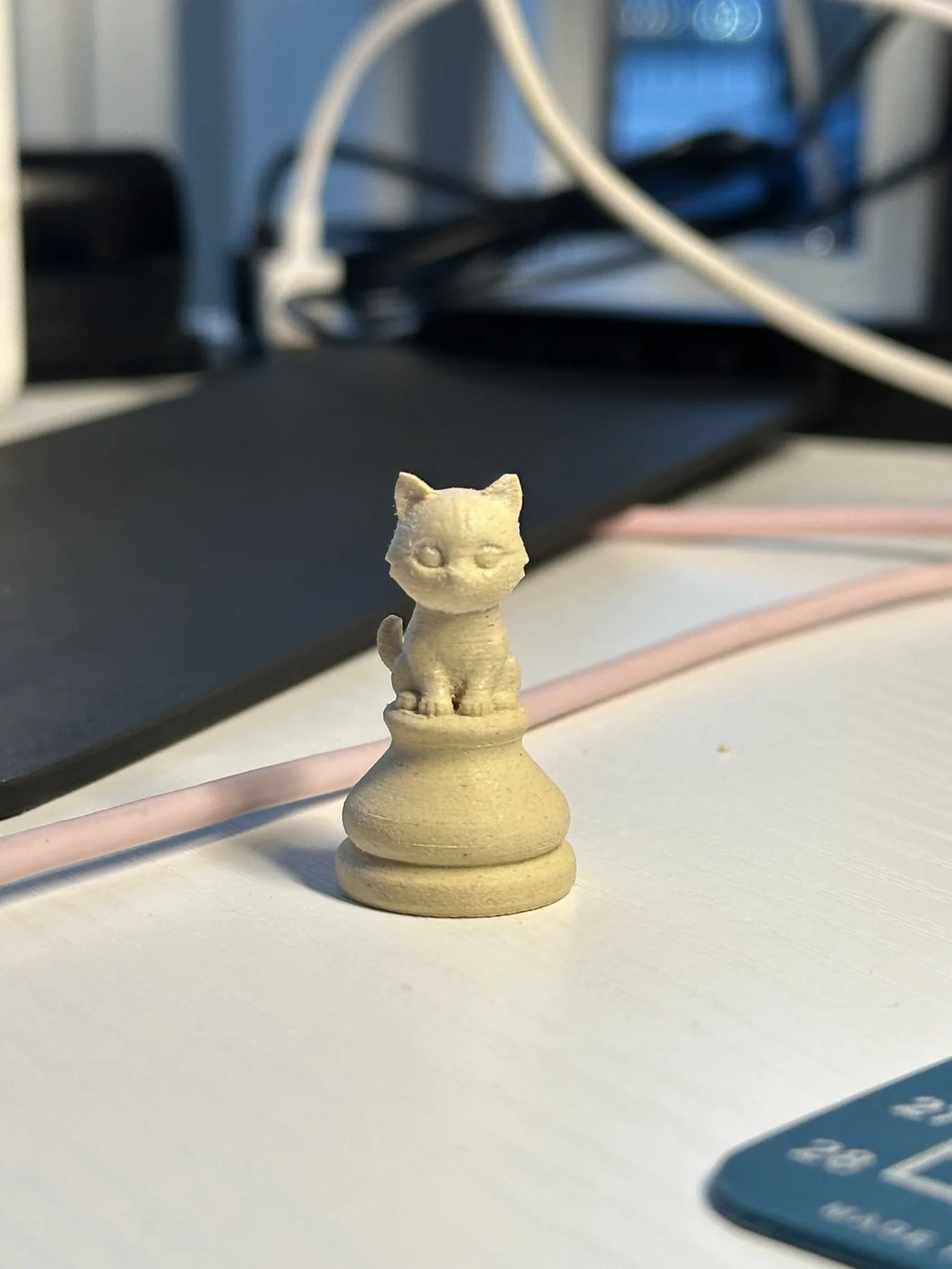 Single printed chess piece during fabrication