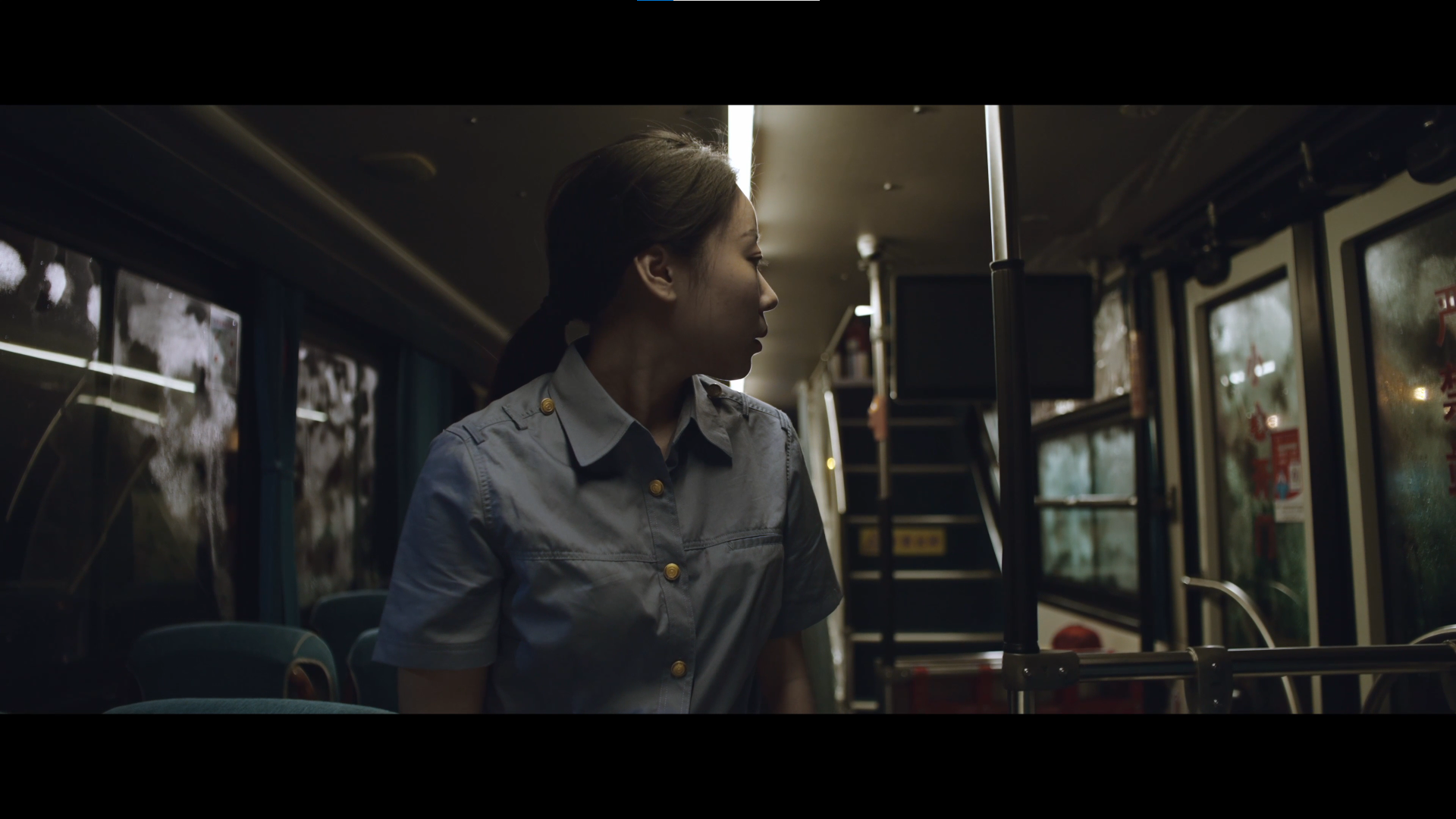 Film 04 cover: a woman inside a night bus